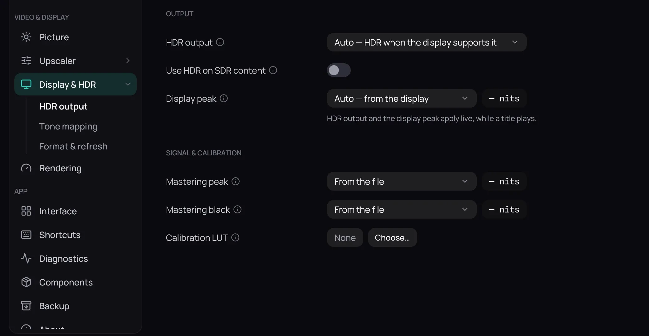 Settings, Display & HDR selected in the rail with its HDR output, Tone mapping and Format & refresh sub-items. Beside it the Output group — HDR output on Auto, Use HDR on SDR content off, Display peak on Auto with a note that both apply live — and Signal & calibration with Mastering peak, Mastering black and Calibration LUT. The three tabs and the Per-display settings group are above the picture.