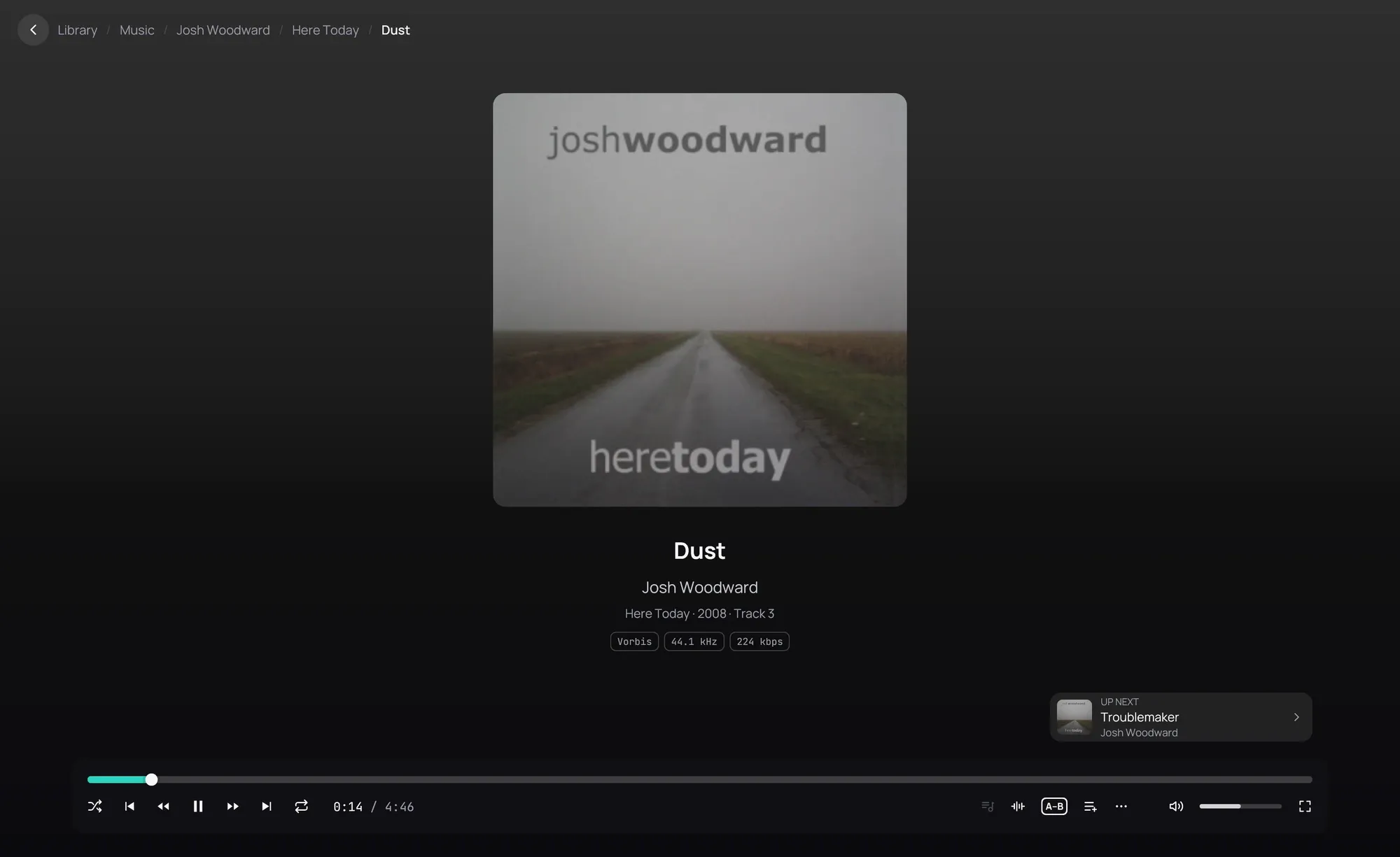 The player on a track, on a background in the cover's colour: the album's cover in the middle, the title, the artist and the album under it, and the playback bar at the bottom