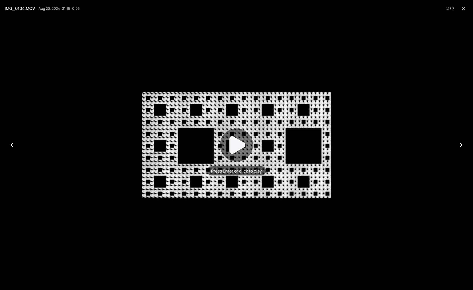 A video in the viewer, showing its picture with a play mark and waiting to be played